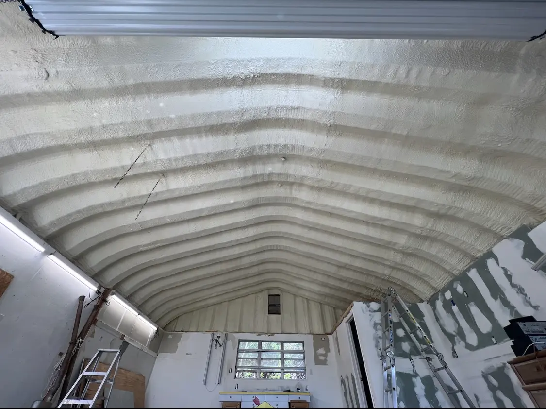 Spray polyurethane foam applied to the underside of a metal roof deck in Tulsa